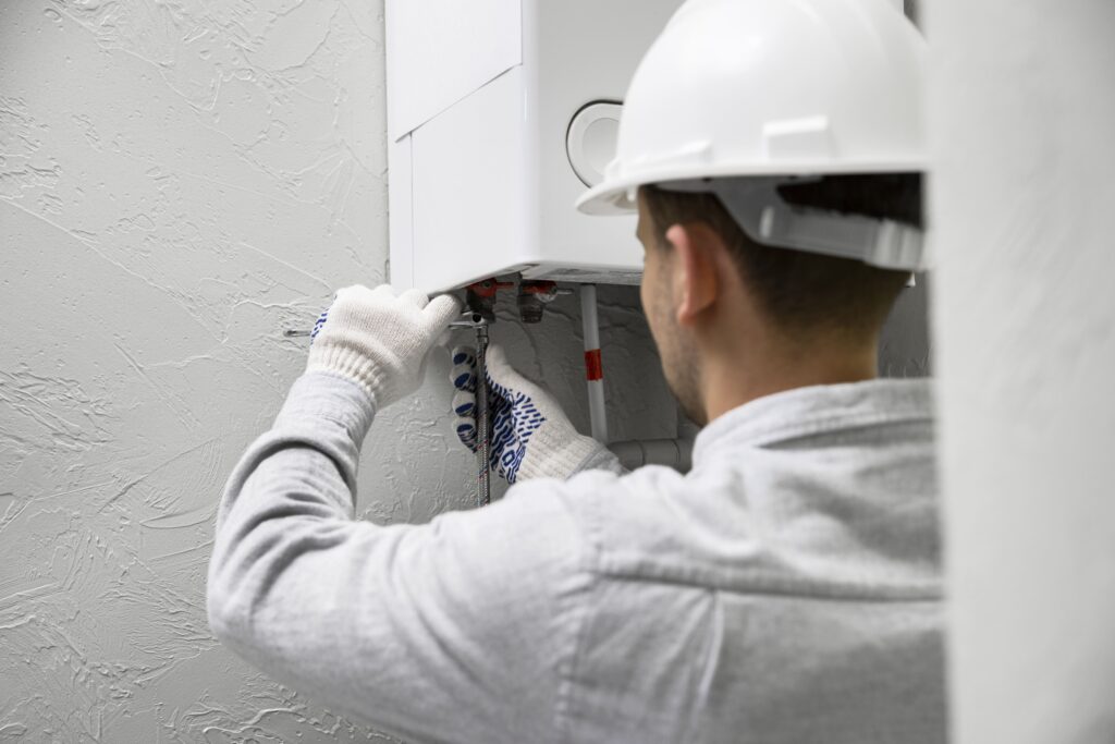 worker-repairing-water-heater (2)